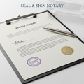 Vehicle affidavit legal document with notary seal and pen on white background